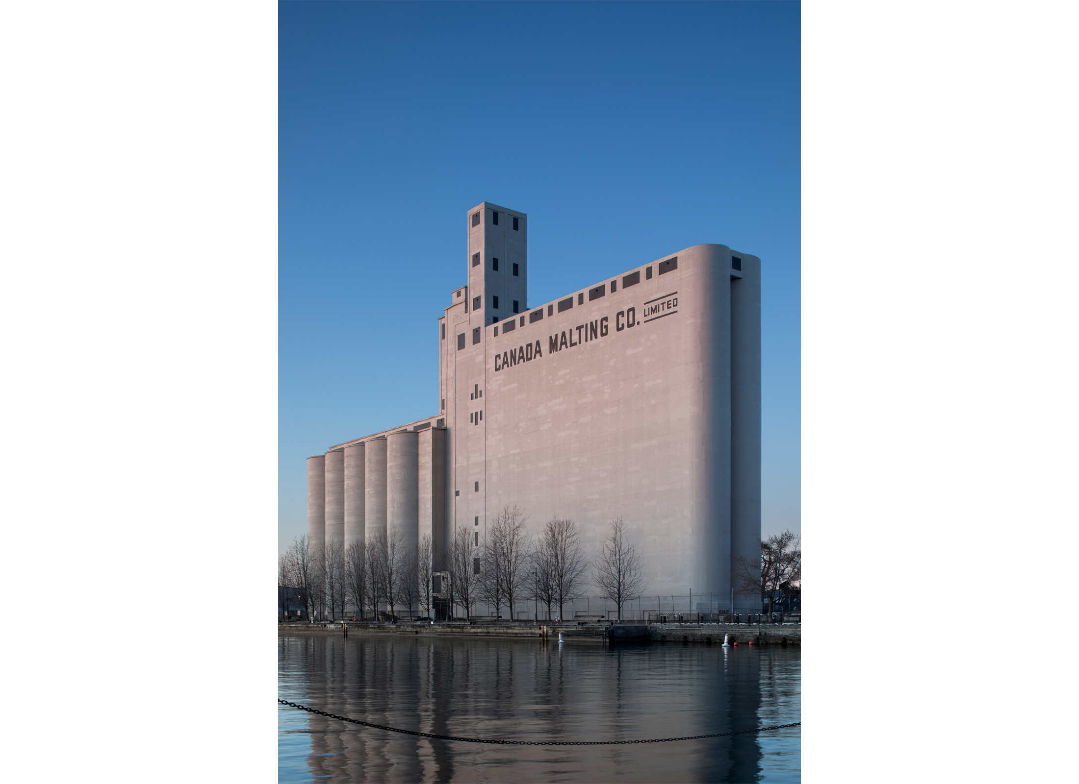 Exterior perspective shot of the Canada Malting Silo, a concrete industrial building along Toronto's Waterfront.