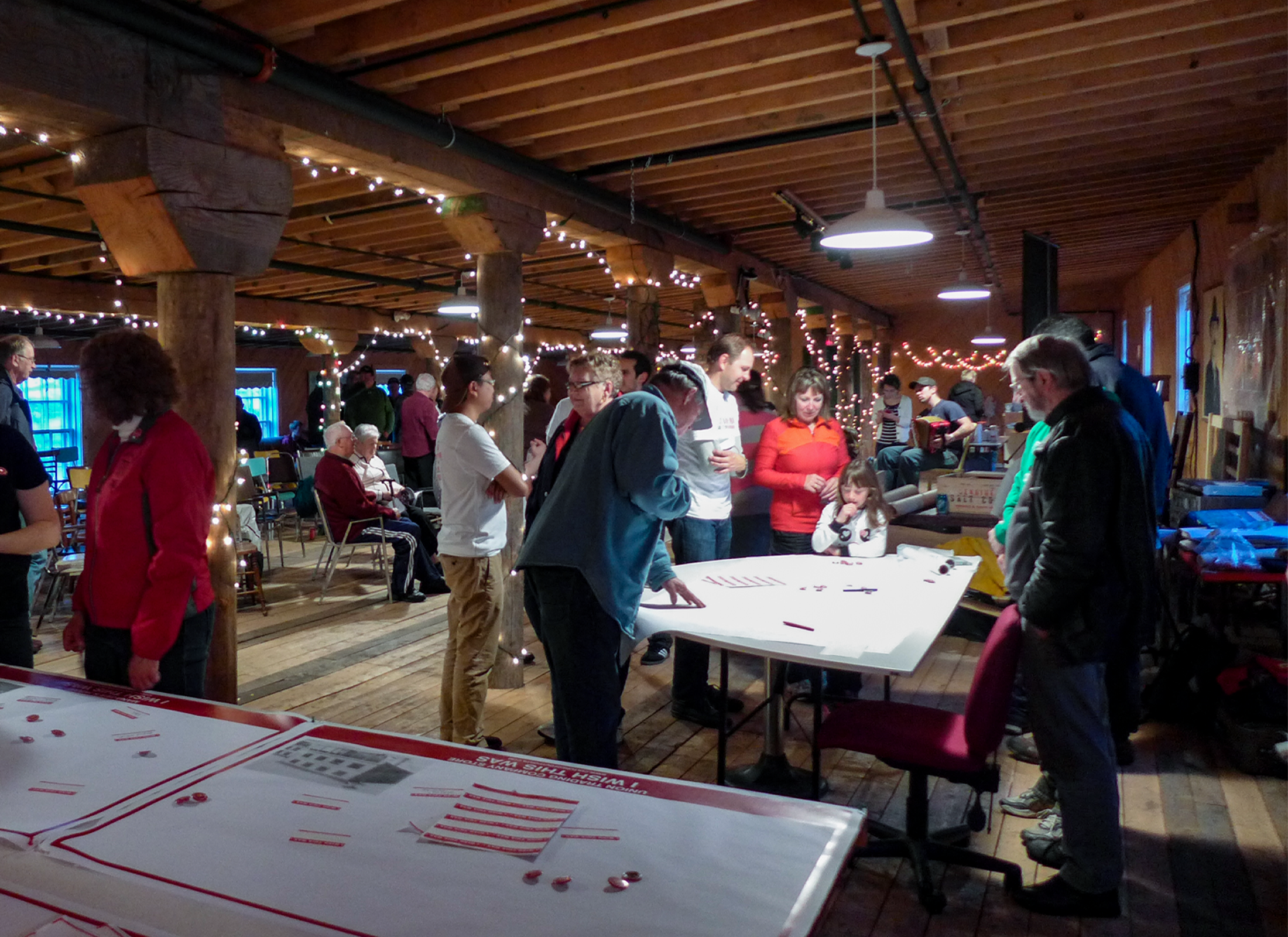Room full of people looking at pieces of paper.