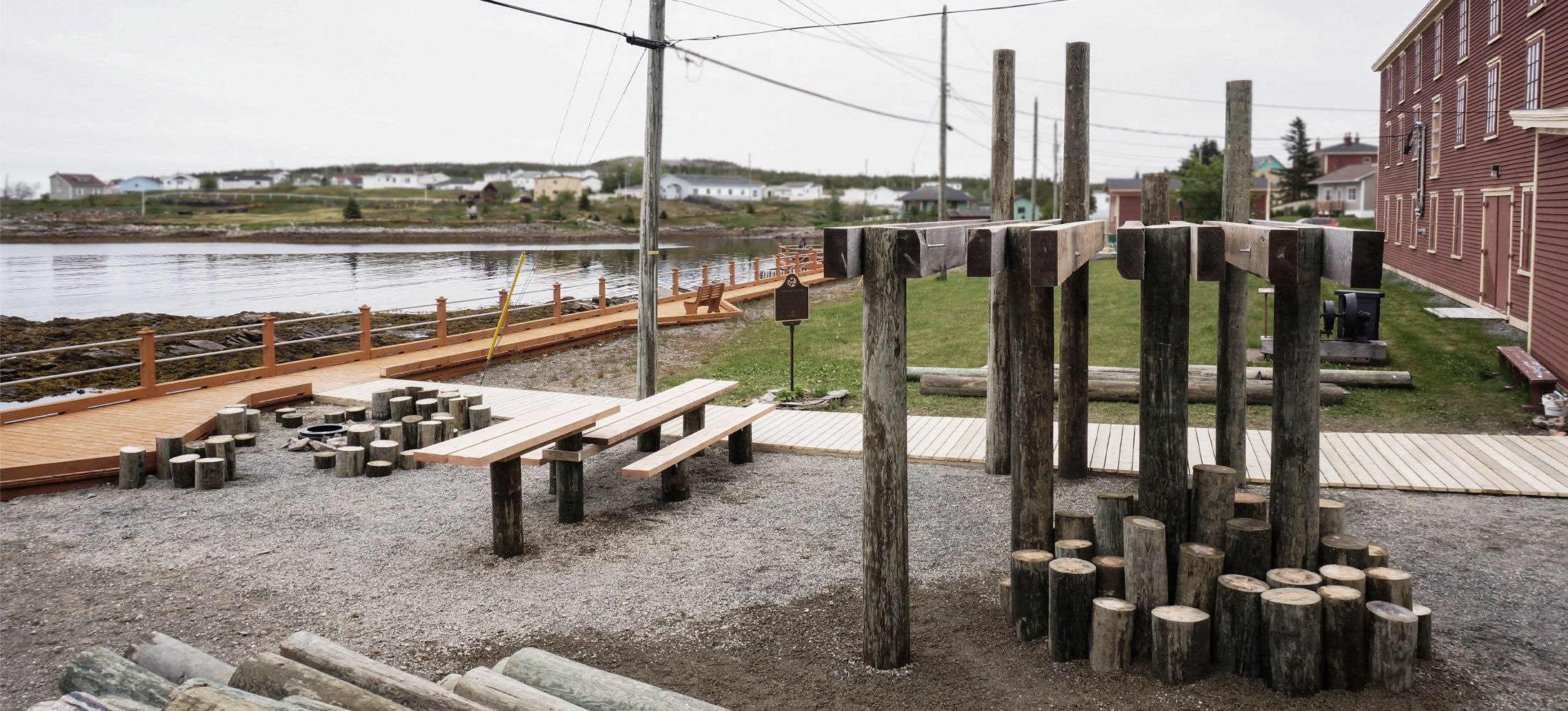 Park by a waterfront made by wood logs.