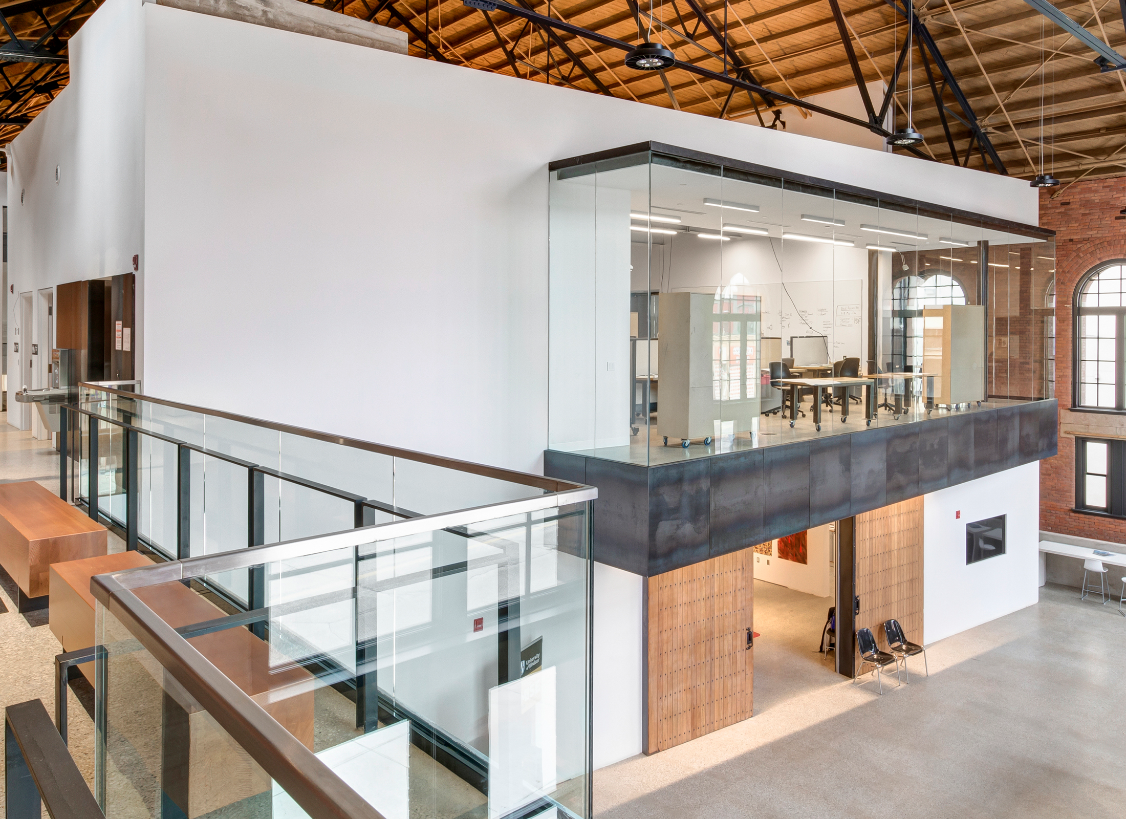 Office area inside large vaulted room.