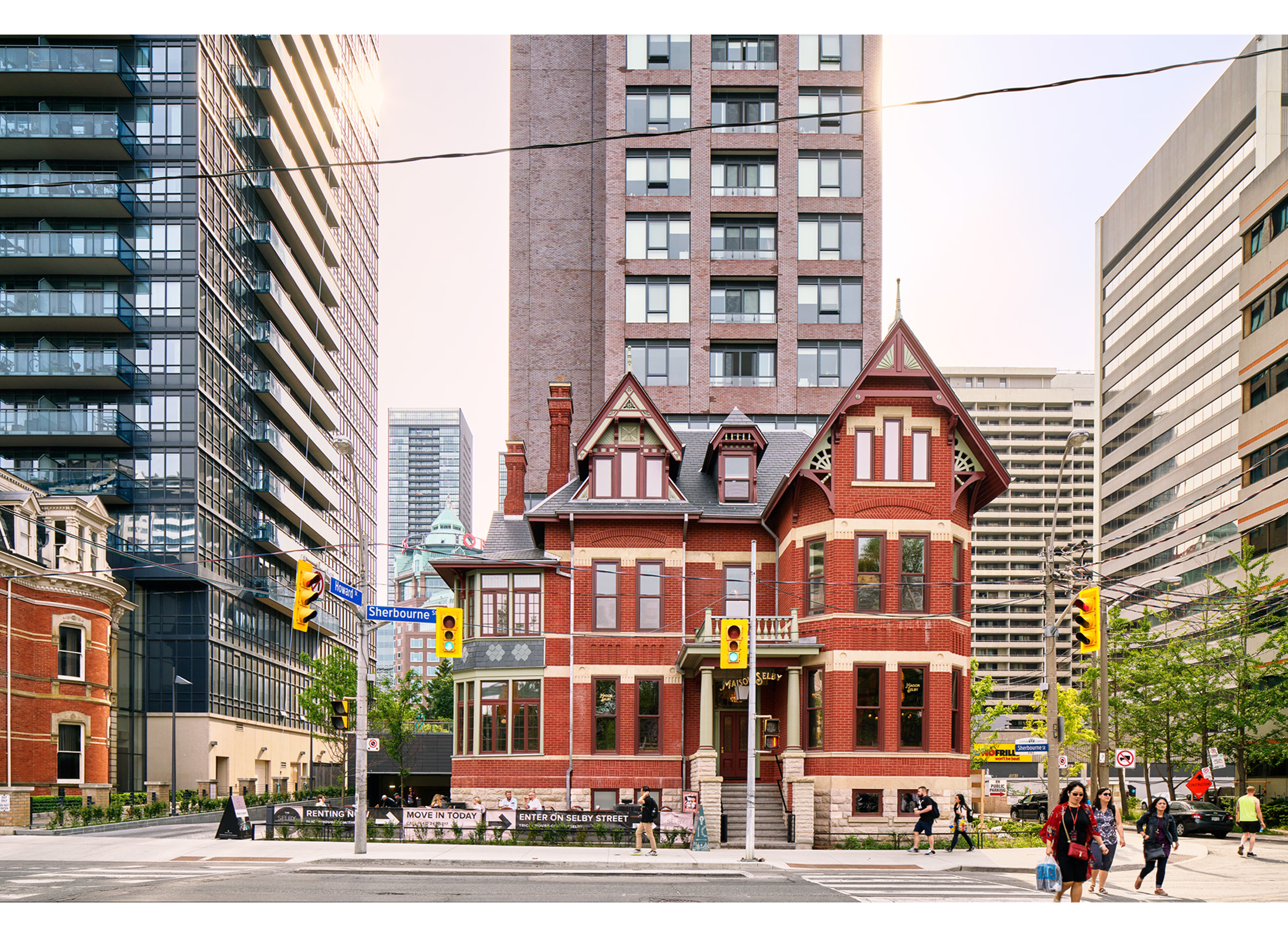 The Selby, a historic Victorian red brick house attached to an adjacent skyscraper.