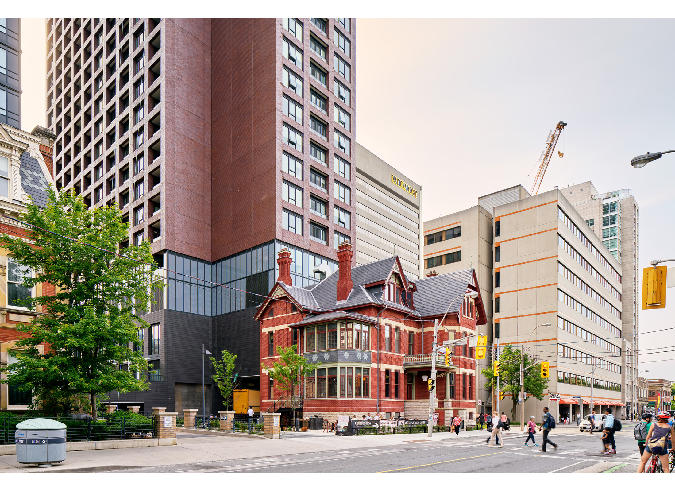The Selby, a historic Victorian red brick house attached to an adjacent skyscraper.