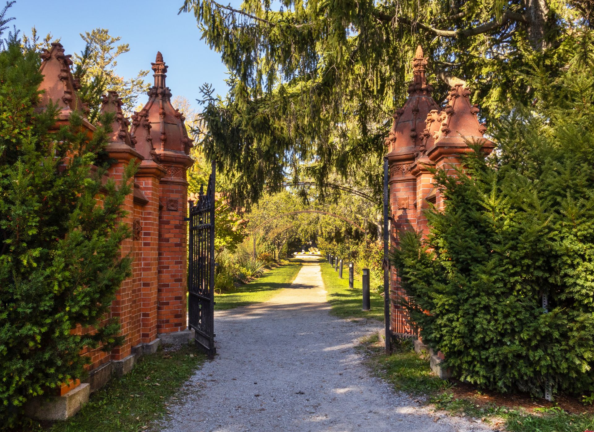 Red brick and iron gates leading to Guildwood Park.