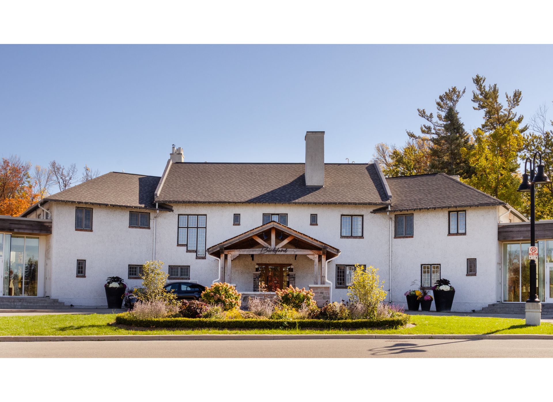 Exterior of the Guild Inn, a stucco mansion with circular dr