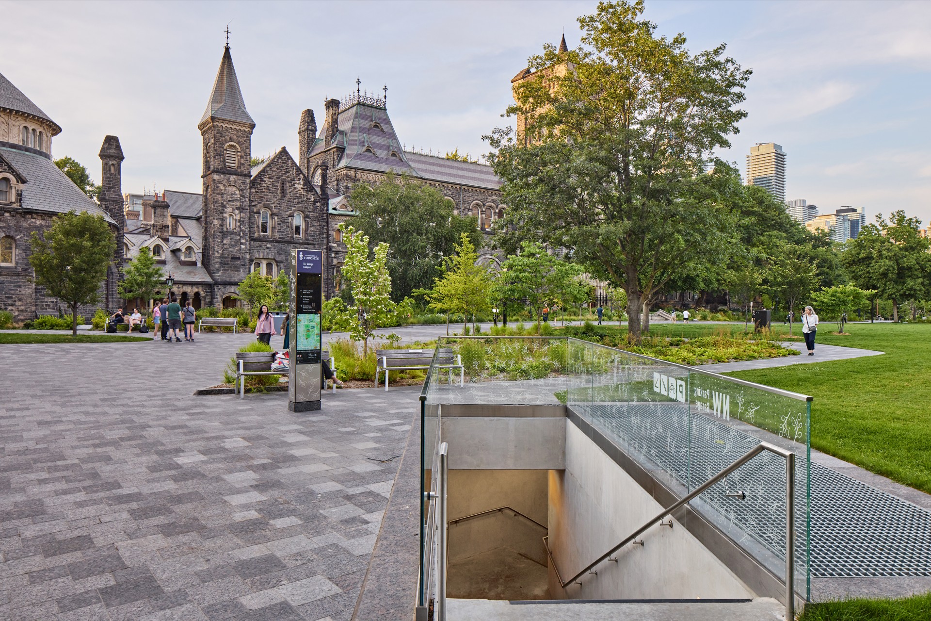 A set of stairs descending underground from the exterior landscape at King's College Circle.