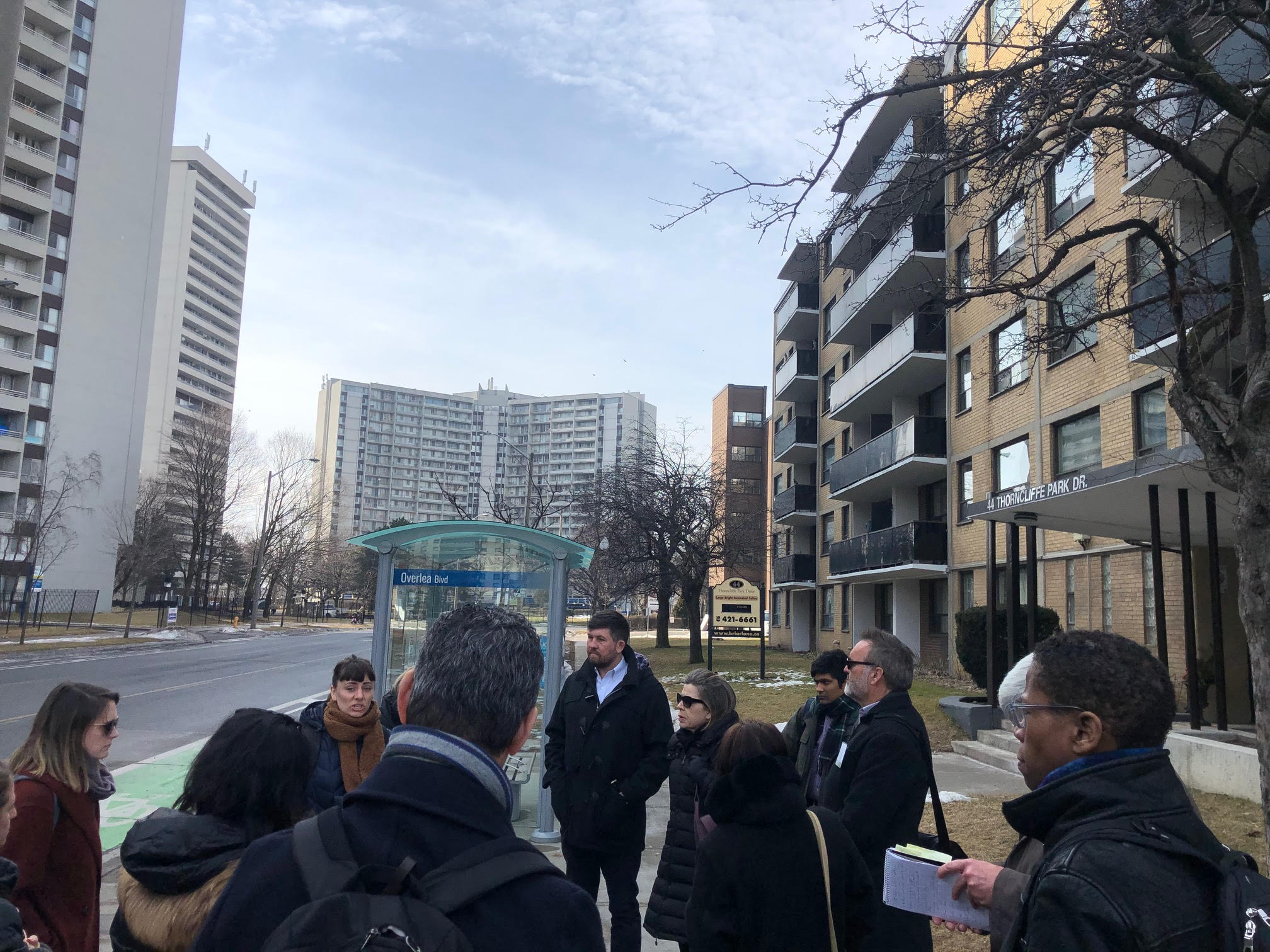 A group touring a tower neighbourhood in Toronto