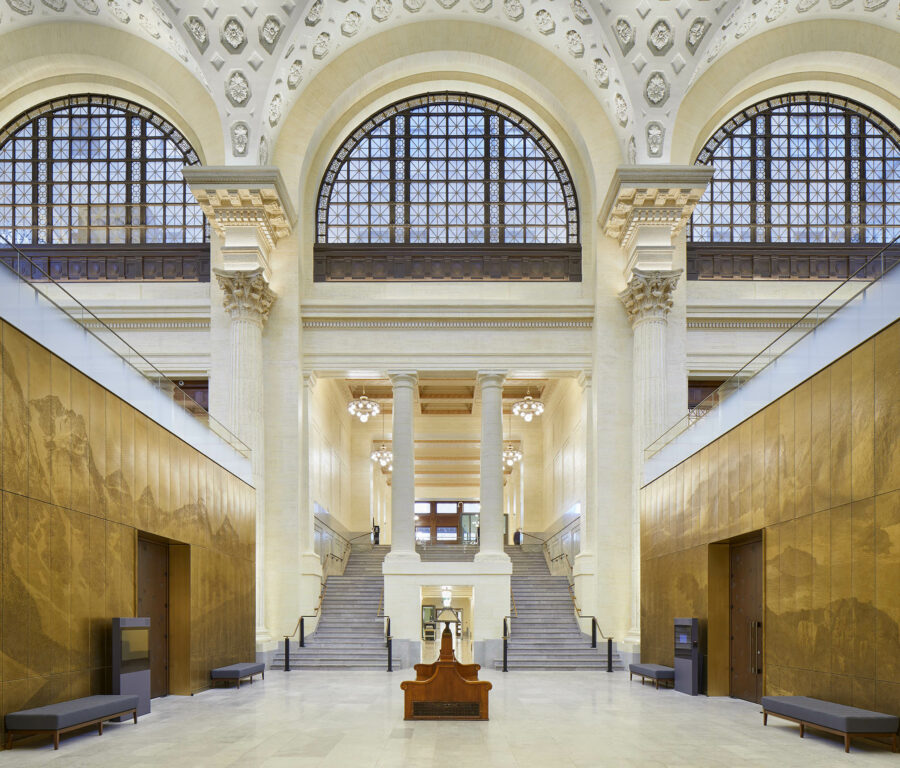 Interior of Senate of Canada Building, showing the grand hall: arched windows and plaster ceiling.