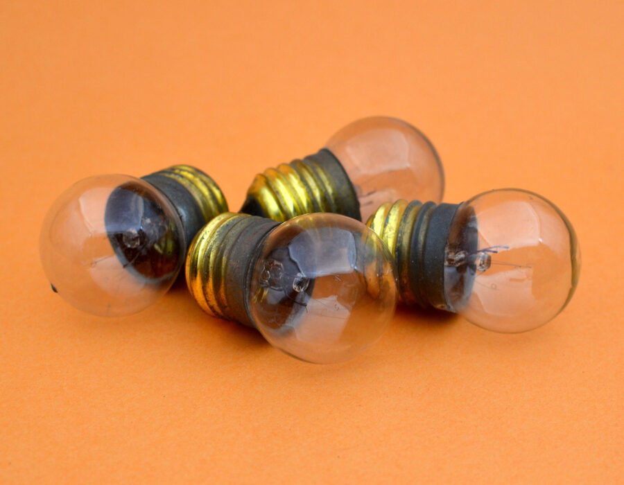 Round, clear glass incandescent lightbulbs. 