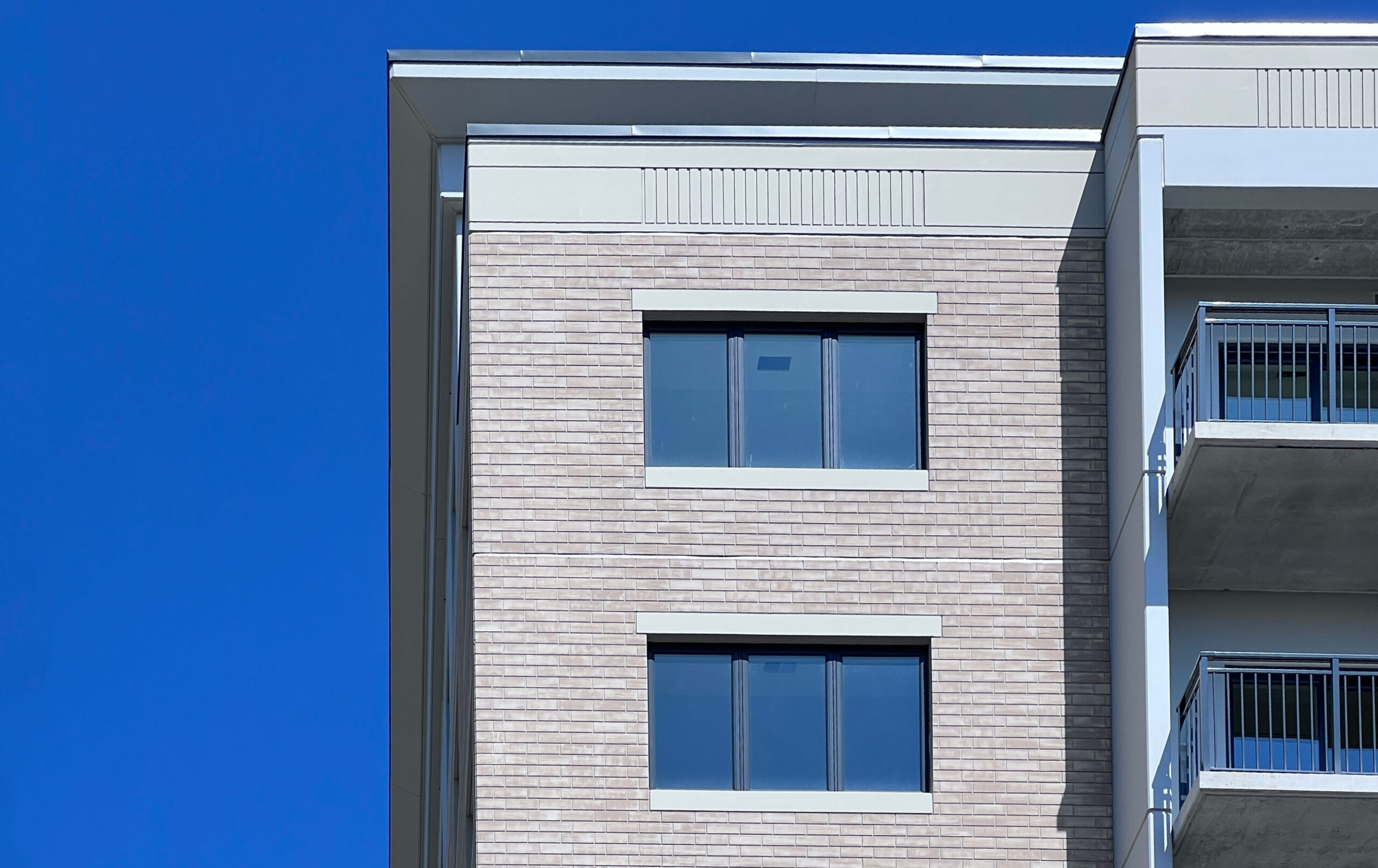 photo of two windows and edges of balconies