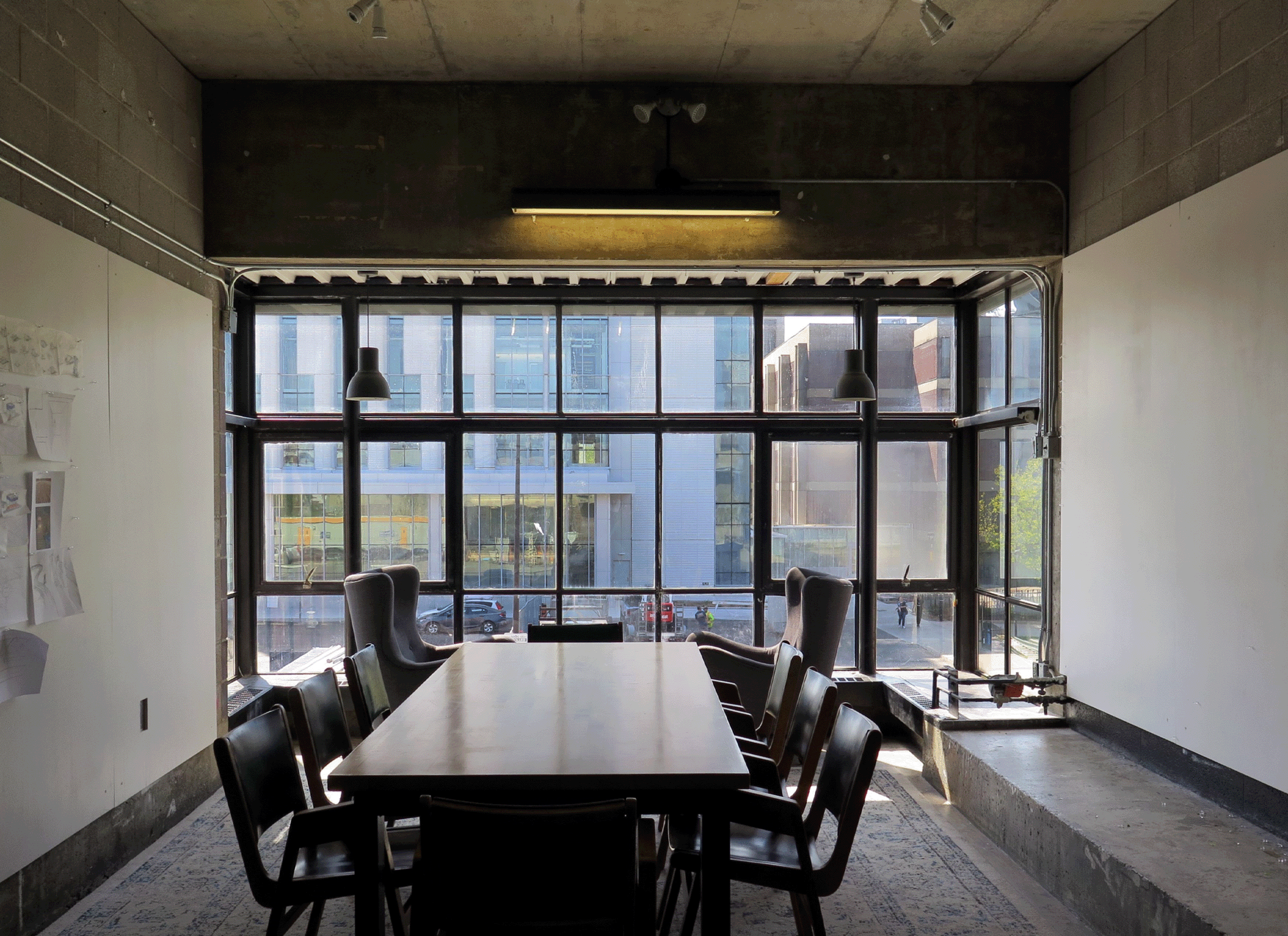 Carleton architecture school study room interior with table and lounge chairs.