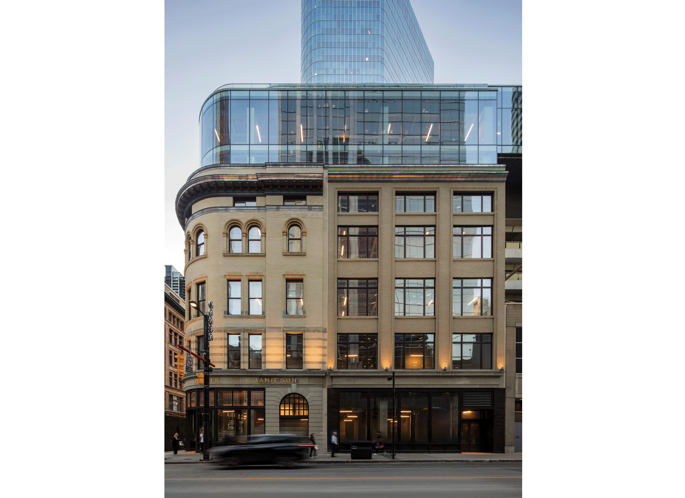 2 Queen Street West Facade with glass addition on top of building.