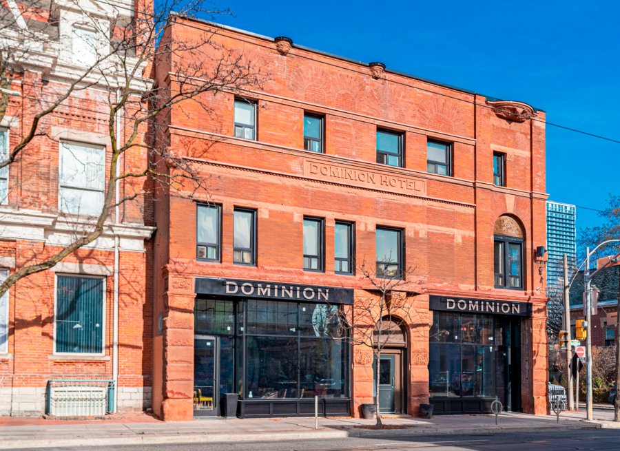 The Historic Dominion Hotel exterior view of red decorative brick.