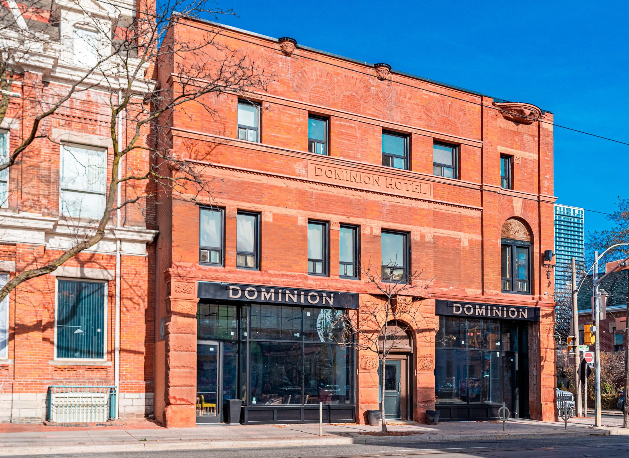 The Historic Dominion Hotel exterior view of red decorative brick.