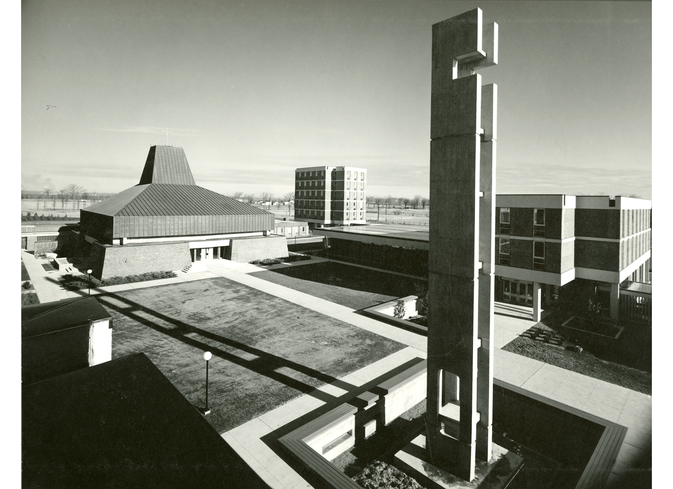 Exterior image of the 1495 Heron Road complex, with concrete tower in the foreground.