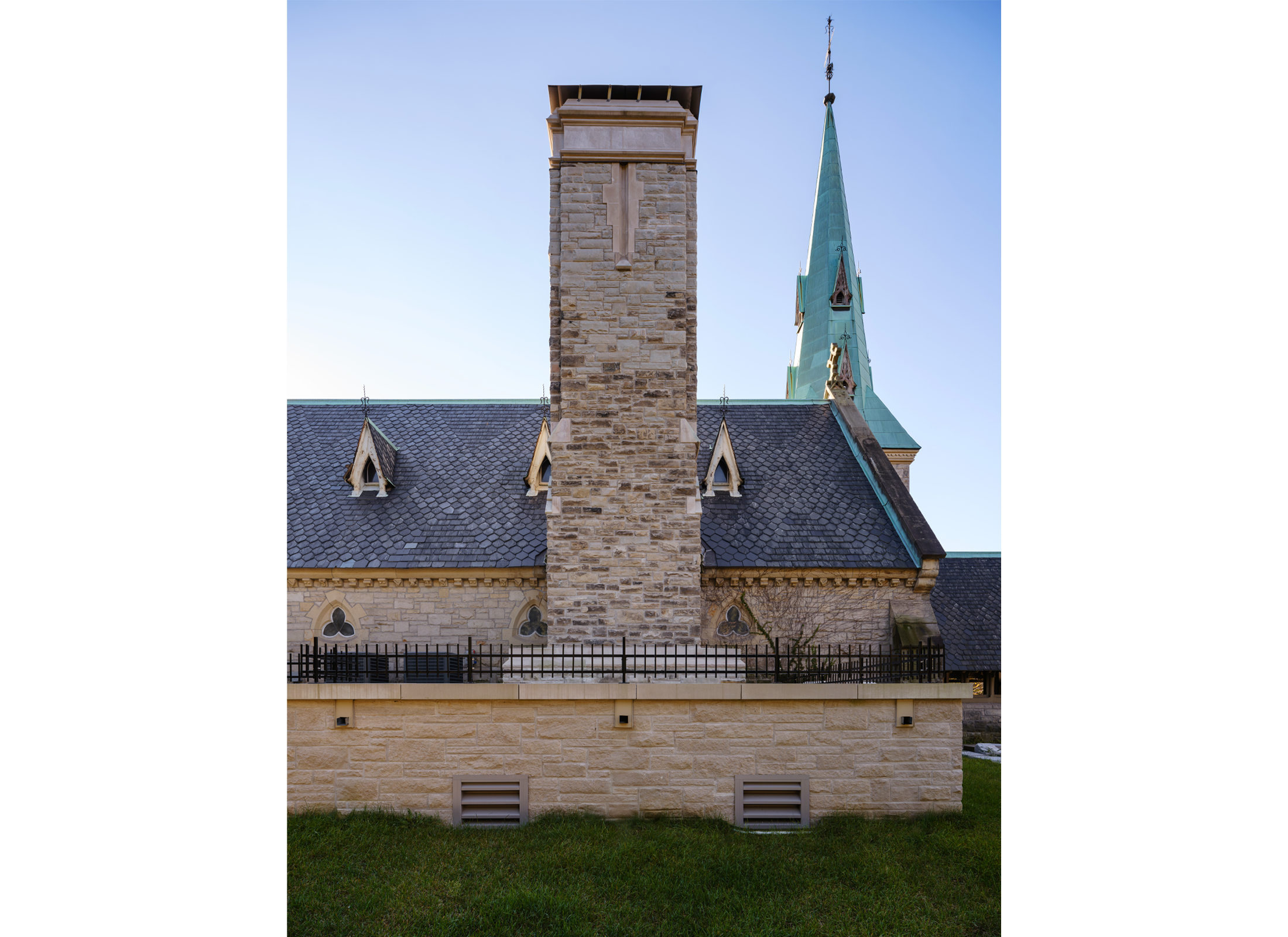 Exterior view of the chimney at St. James Chapel, a stone church.