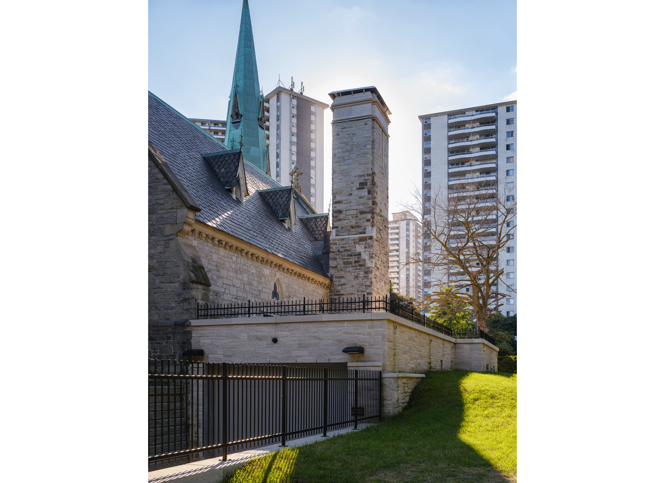 Exterior view of the loading bay at St. James Chapel, a stone church.