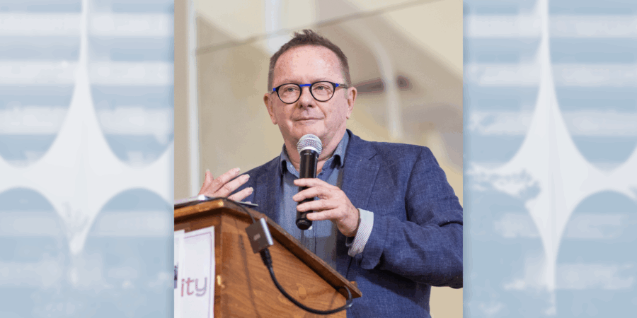 Michael McClelland Presenting at a podium.