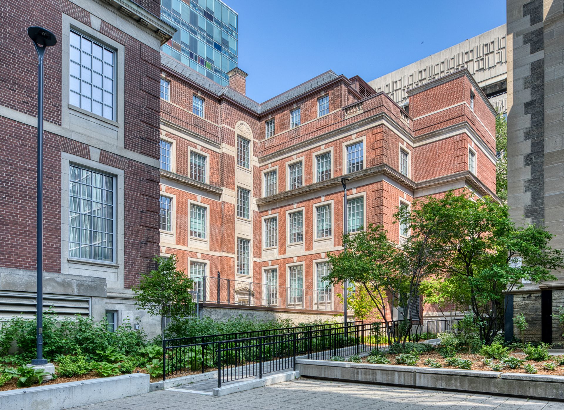 Exterior elevation of the Fitzgerald building, a three storey Georgian Revival building made of red brick with rooftop glass extension.