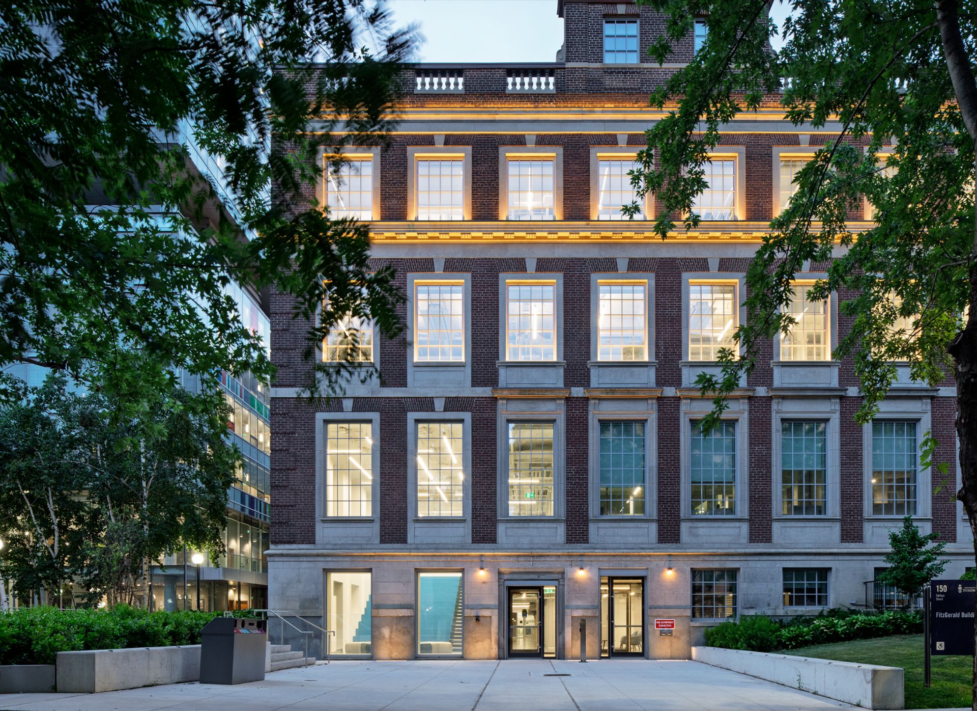 Exterior viewof the Fitzgerald building, a three storey Georgian Revival building made of red brick with rooftop glass extension.