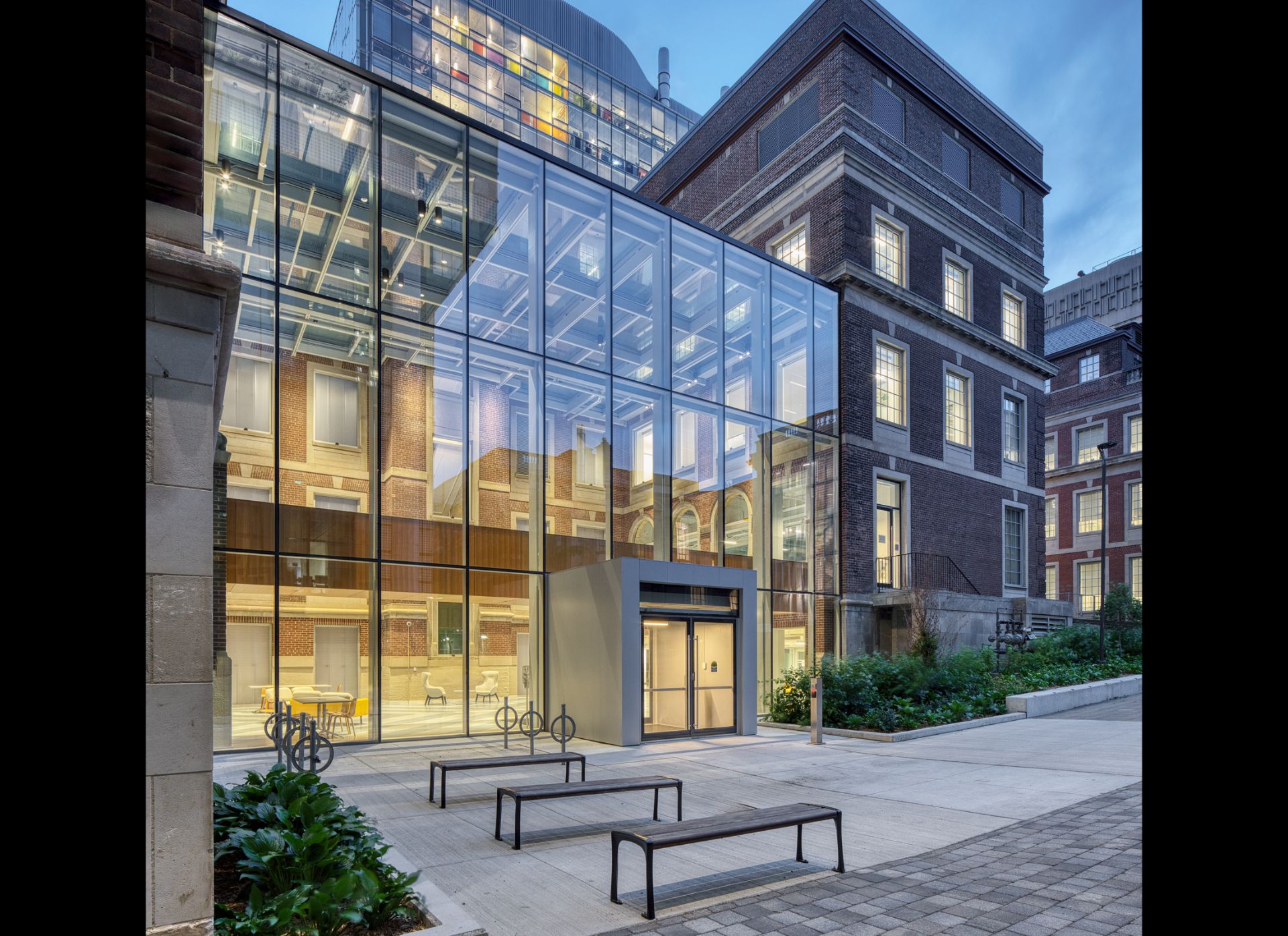Exterior view of the Fitzgerald building, a three storey Georgian Revival building made of red brick with rooftop glass extension.