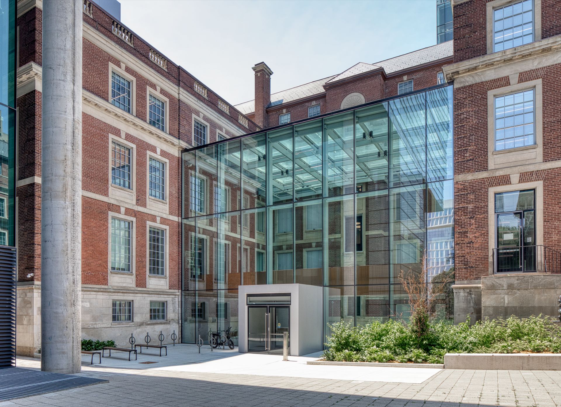 Exterior view of the Fitzgerald building, a three storey Georgian Revival building made of red brick with rooftop glass extension.