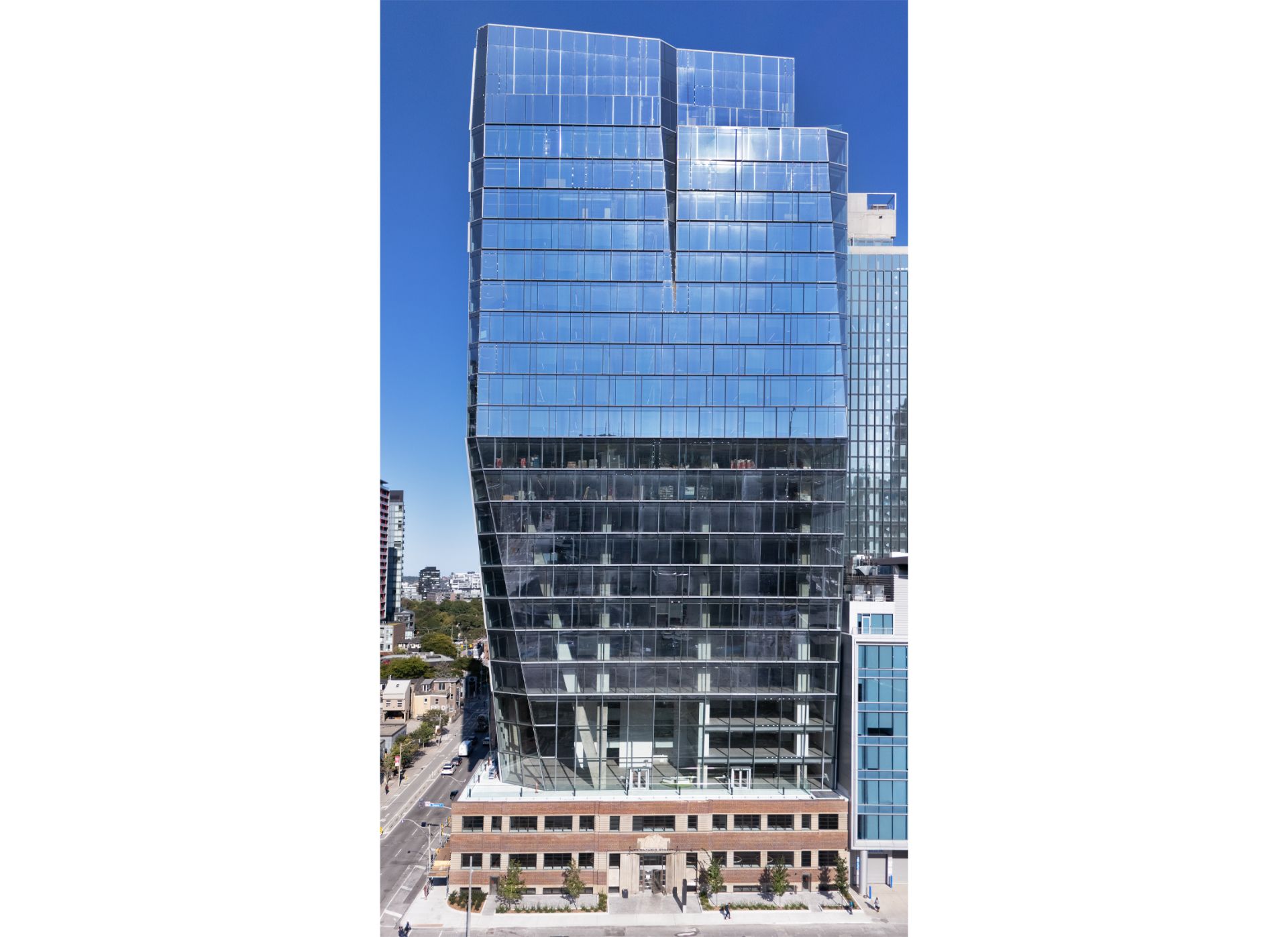 25 Ontario street, a three storey brick heritage building with a large glass tower on top.