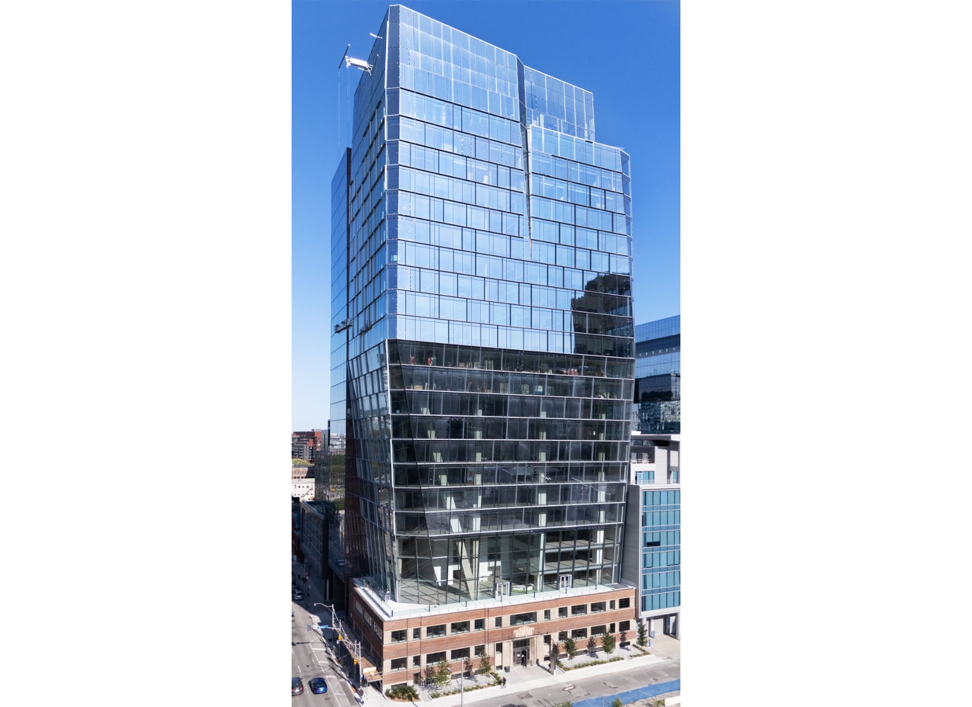 25 Ontario street, a three storey brick heritage building with a large glass tower on top.