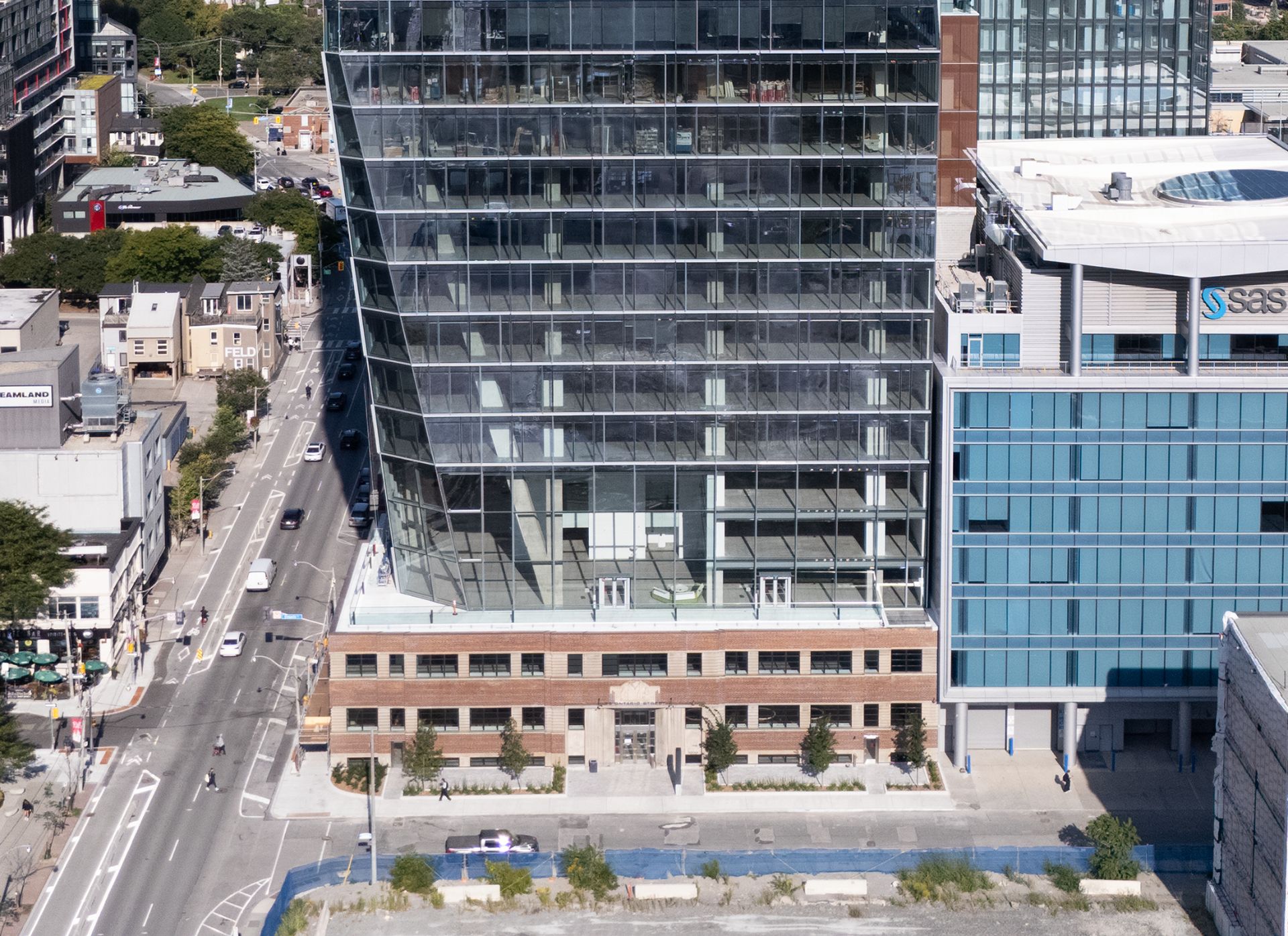25 Ontario street, a three storey brick heritage building with a large glass tower on top.
