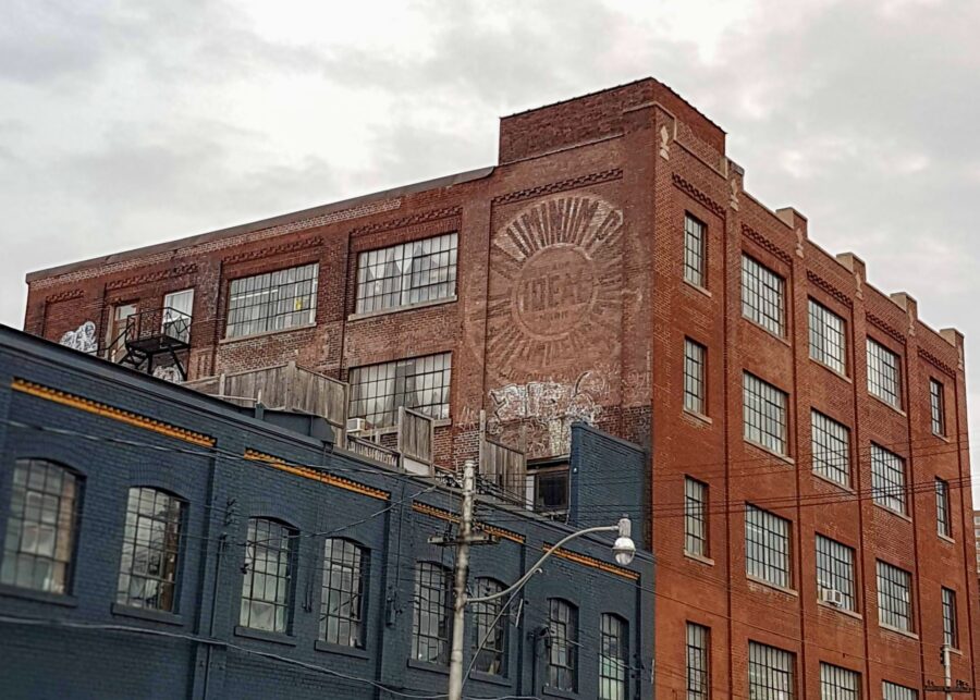 Old factory buildings with Ideal Aluminum ghost sign