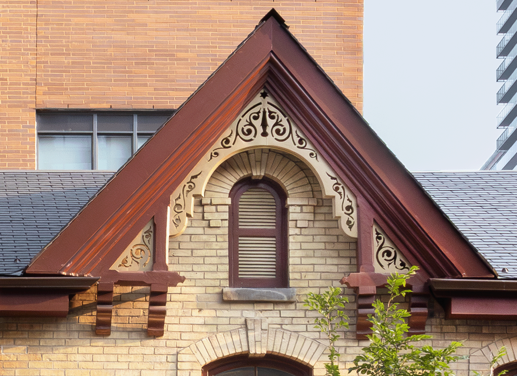 Decorative gable and arched window of the Charles Levey House.
